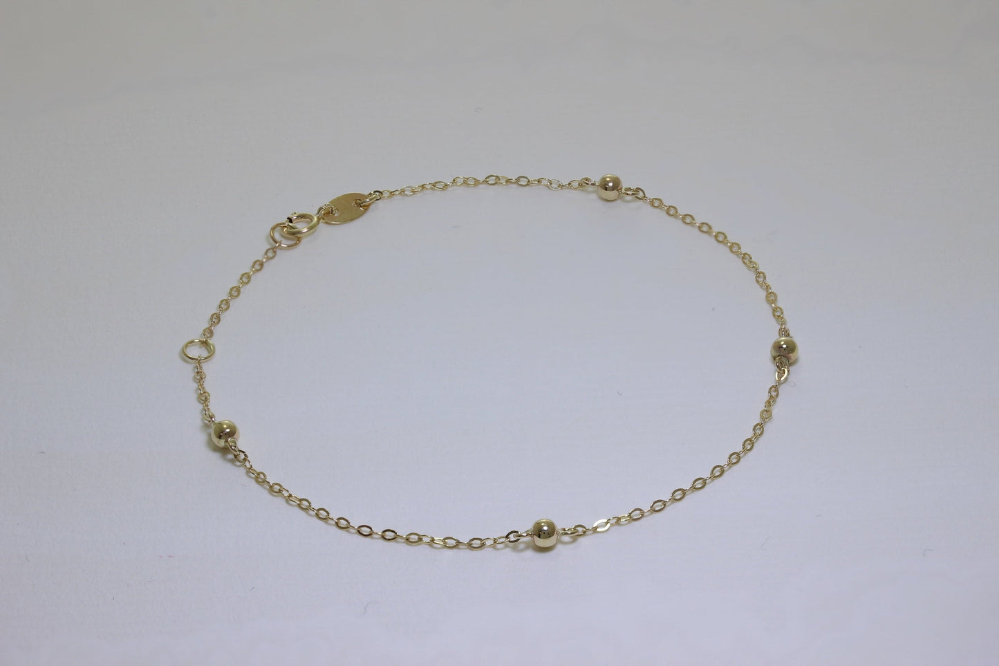 Bracelet extensible en or 9 carats avec pompon martelé de 19 cm