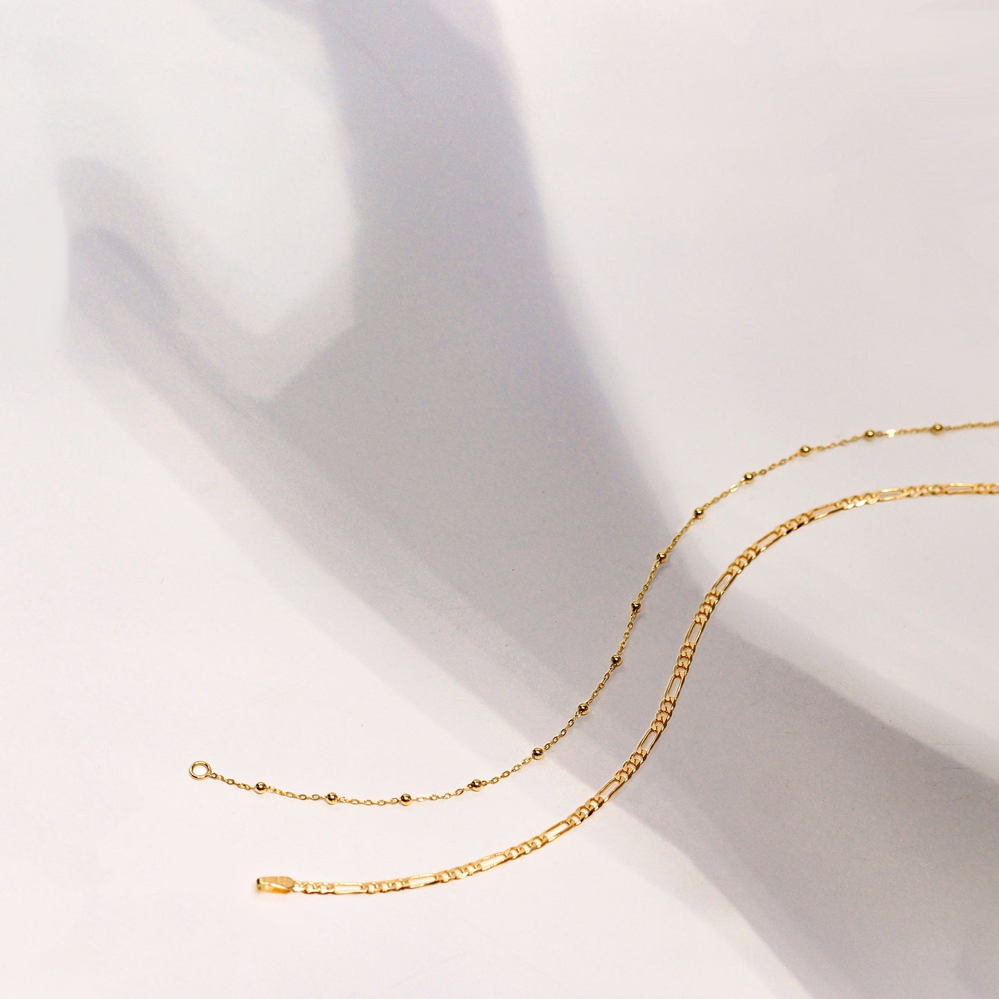 Bracelet gourmette Figaro ouvert en or 9 carats taille diamant 7,5"