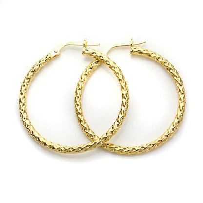 Boucles d'oreilles créoles torsadées en or jaune 9 carats