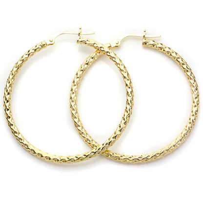 Boucles d'oreilles créoles torsadées en or jaune 9 carats