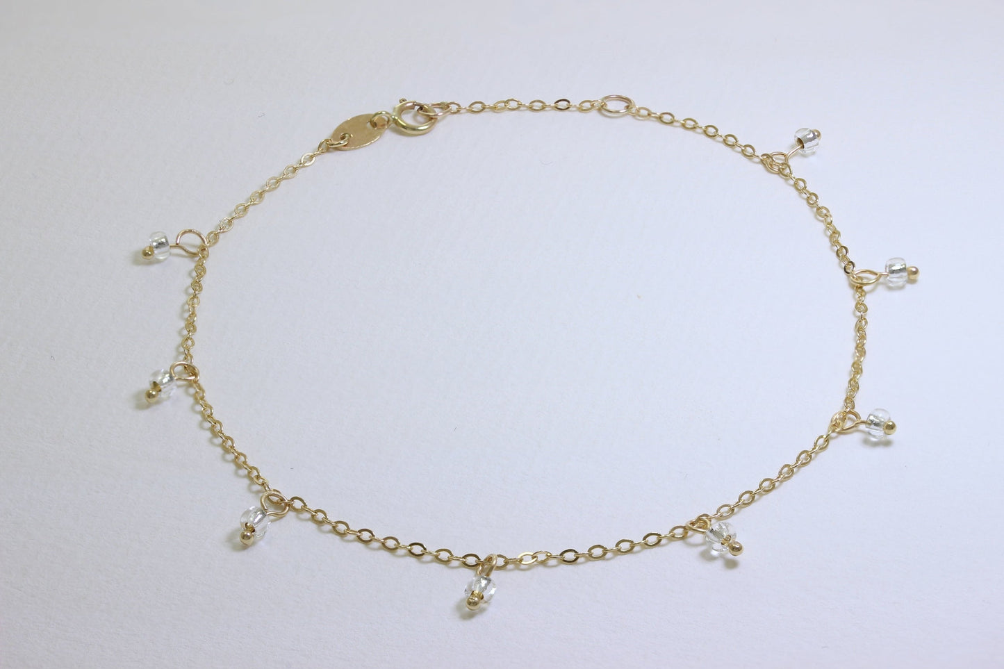 Bracelet extensible en or 9 carats de 19 cm avec perles en oxyde de zirconium transparent