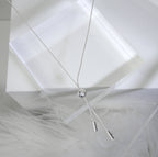 Collier réglable en argent sterling avec pendentif à double pompon et boule