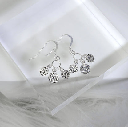 Boucles d'oreilles chandelier à triple disque facetté en argent sterling