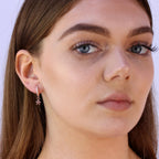Boucles d'oreilles créoles en argent sterling plaqué or rose avec breloque étoile de 12 mm