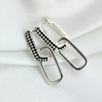 Boucles d'oreilles créoles ovales en argent sterling avec zircones cubiques noirs