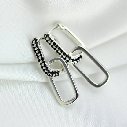 Boucles d'oreilles créoles ovales en argent sterling avec zircones cubiques noirs