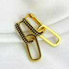Boucles d'oreilles créoles ovales en argent sterling plaqué or avec zircones cubiques noirs