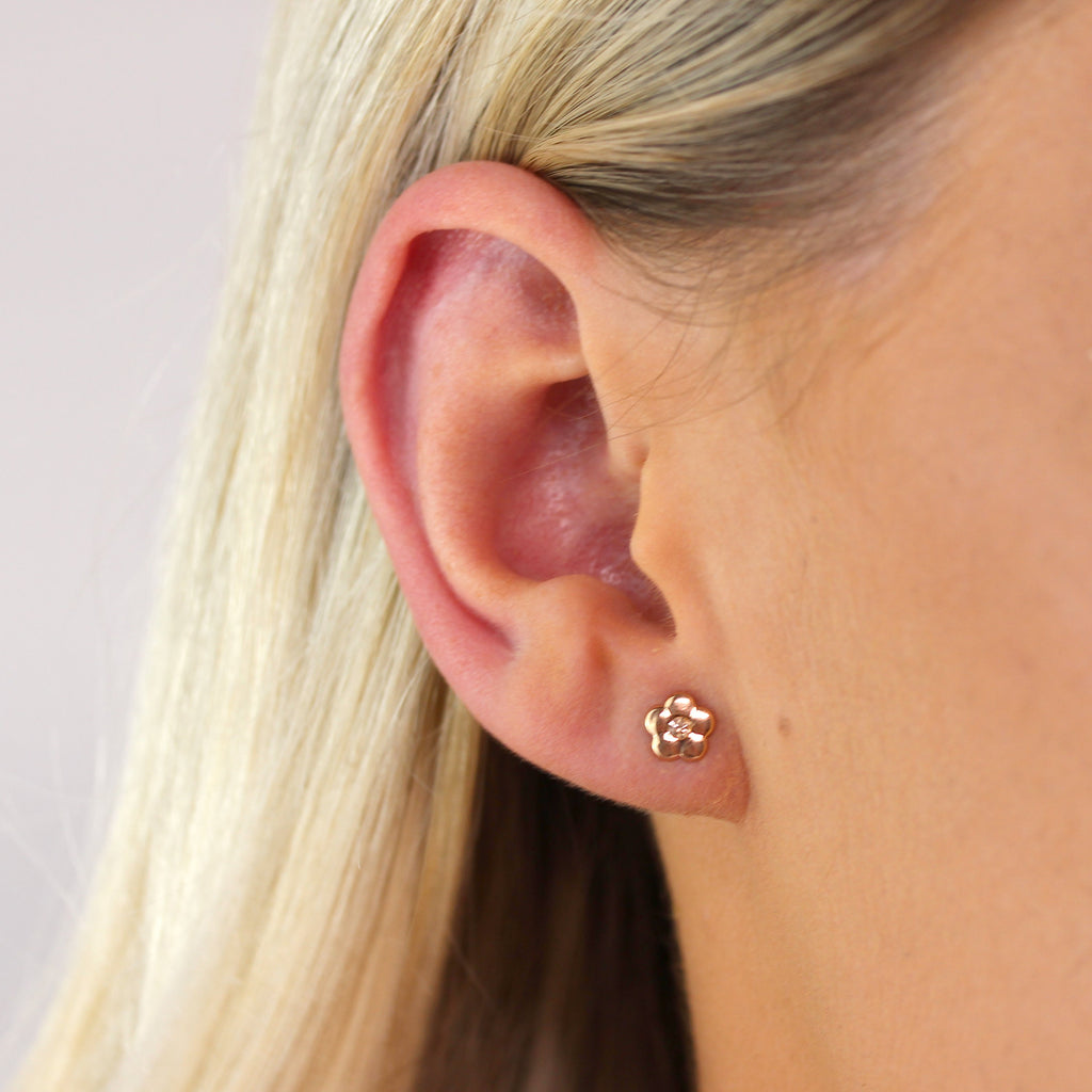 Boucles d'oreilles à tige en or rose 9 carats et cristal CZ orange en forme de fleur plate