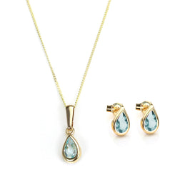 Ensemble pendentif et boucles d'oreilles à tige en or 9 carats et pierre de naissance de mars
