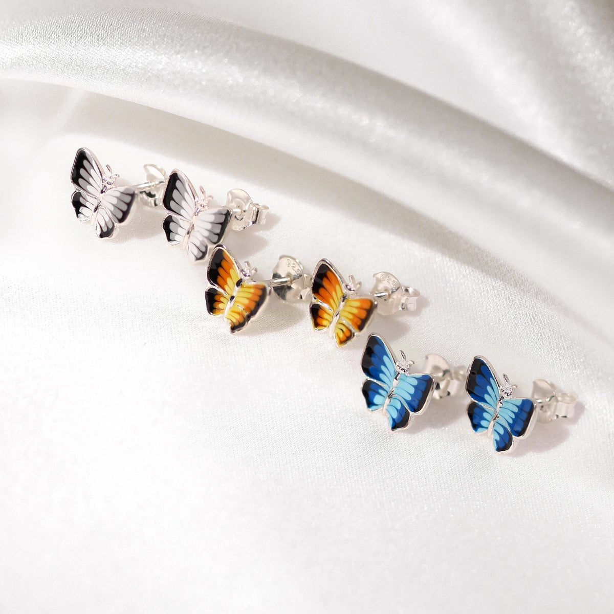 Boucles d'oreilles papillon plates en argent sterling et émail
